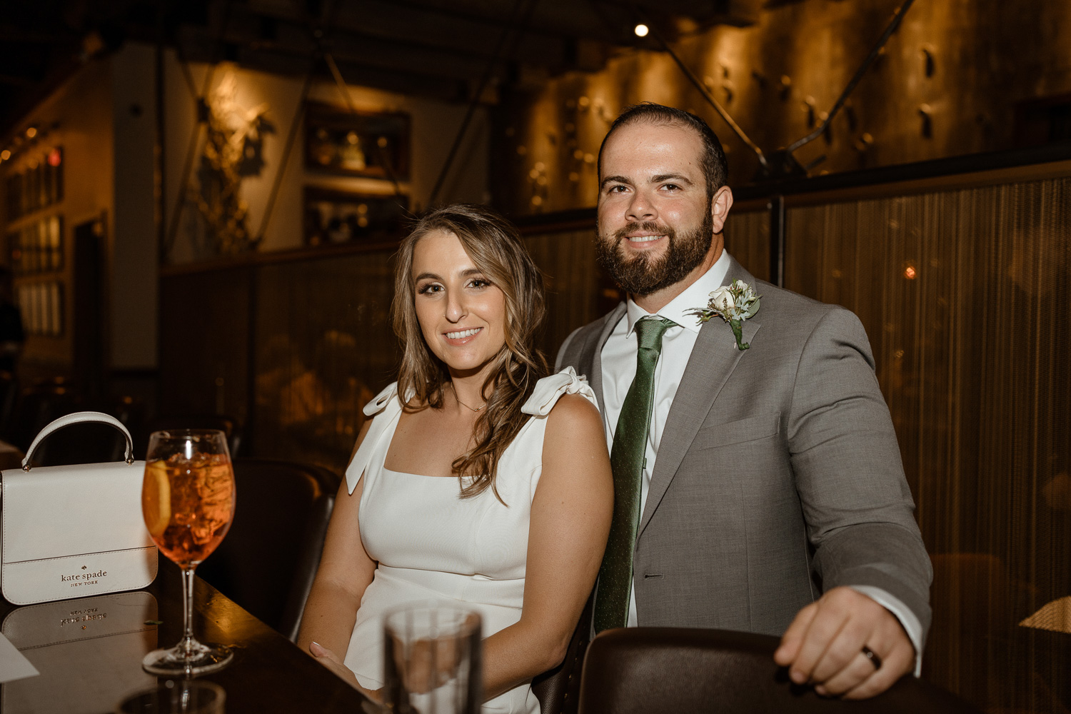 Bride and Groom pose at the bar before their intimate reception dinner at Posana where they celebrate their Asheville elopement